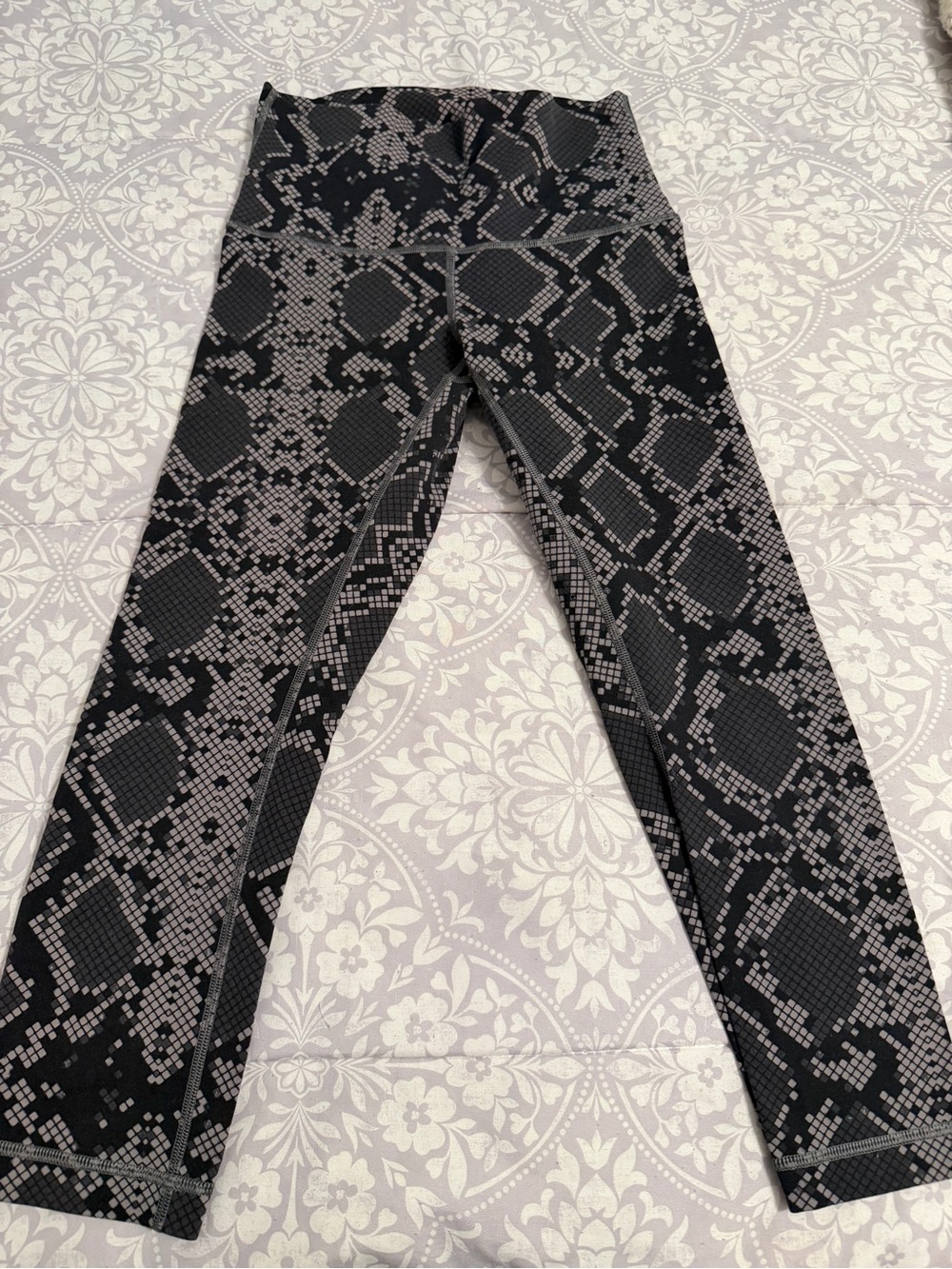 Lululemon Black and Cropped Gray Snake Print Leggings